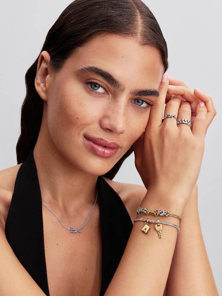 Besos Schrift Charm 14 Karat Vergoldung